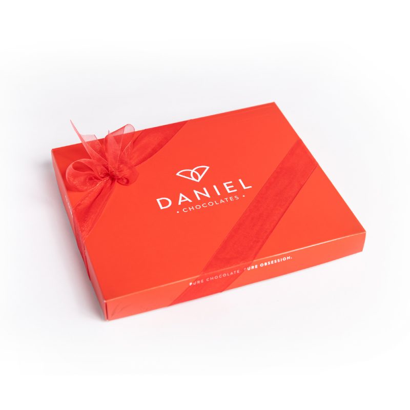Daniel Chocolates_Classic Chocolate Box, 44pc This more extensive selection of our delicious chocolates will provide you with a delightful experience. This chocolate box holds an assortment of 44 pieces for you to enjoy. At Daniel’s, we like to keep things simple by not mixing too many conflicting tastes. We keep our flavours simple because often less is more. You can easily recognize all our ingredients; they are not difficult to pronounce, and you don’t need a chemistry degree to know them. All our flavours result from infusing whipping cream with natural herbs and spices, just as simple as that! Buy your chocolate box now, and taste our ganaches or truffles; you will quickly identify what is inside. Pure Chocolate, Pure ingredients, More cocoa, Less sugar