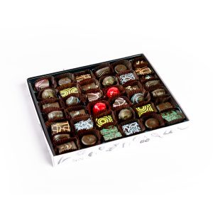 Daniel Chocolates_Classic Chocolate Box, 44pc Dark This more extensive selection of our delicious chocolates will provide you with a delightful experience. This chocolate box holds an assortment of 44 pieces for you to enjoy. At Daniel’s, we like to keep things simple by not mixing too many conflicting tastes. We keep our flavours simple because often less is more. You can easily recognize all our ingredients; they are not difficult to pronounce, and you don’t need a chemistry degree to know them. All our flavours result from infusing whipping cream with natural herbs and spices, just as simple as that! Buy your chocolate box now, and taste our ganaches or truffles; you will quickly identify what is inside. Pure Chocolate, Pure ingredients, More cocoa, Less sugar